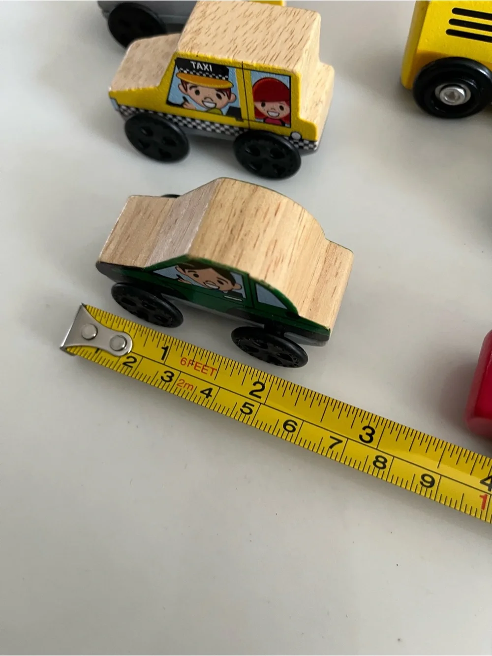 8 wooden cars and trucks.  Four are kidKraft.